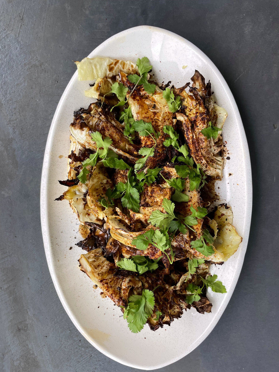 A dish of roasted chicories with fresh herbs